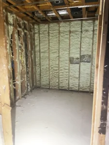 Walls and insulation before water damage restoration